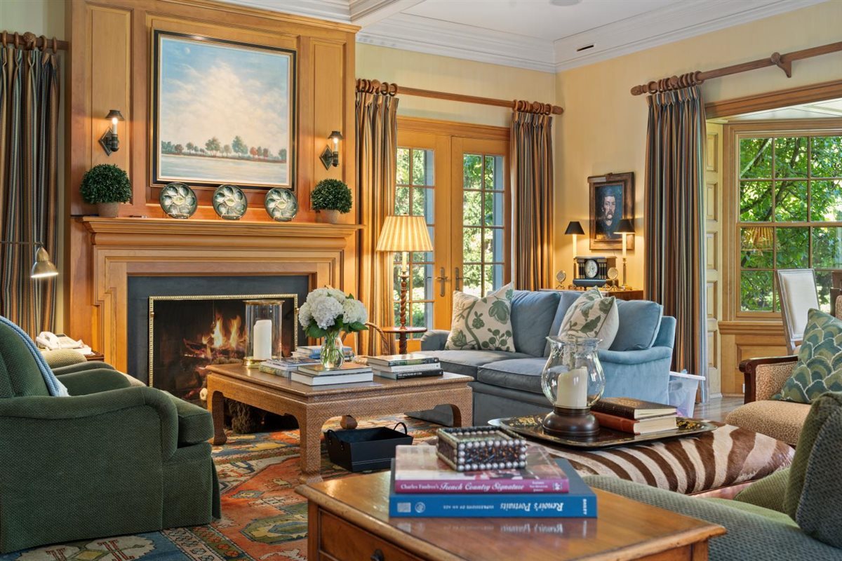 5 Woodley Road Winnetka, IL 60093 - Photo 21 of 48 a living room with furniture and a fireplace