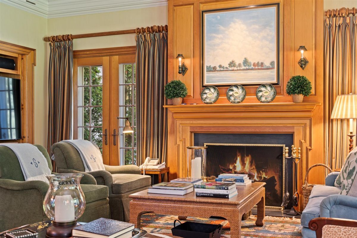 5 Woodley Road Winnetka, IL 60093 - Photo 23 of 48 a living room with furniture and a fireplace