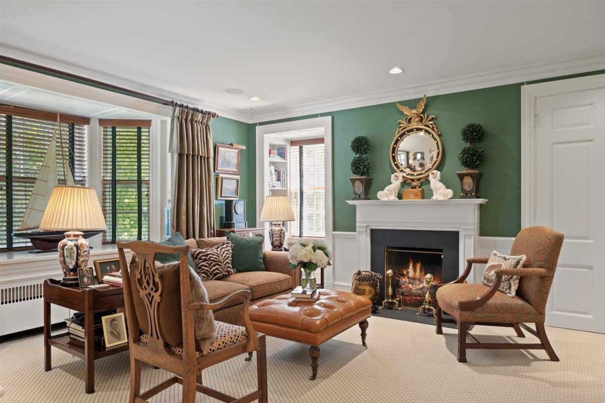 5 Woodley Road Winnetka, IL 60093 - Photo 30 of 48 a living room with furniture and a fireplace