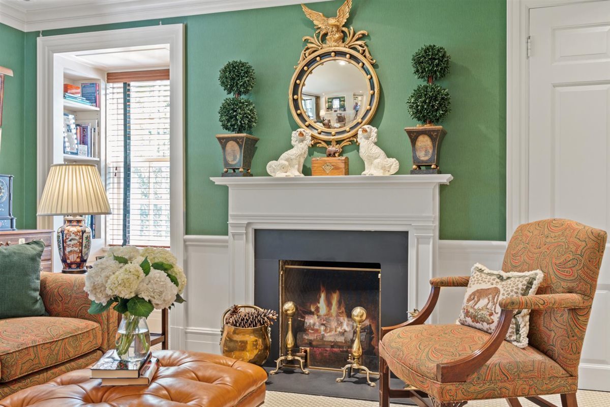 5 Woodley Road Winnetka, IL 60093 - Photo 31 of 48 a living room with furniture a fireplace and a potted plant