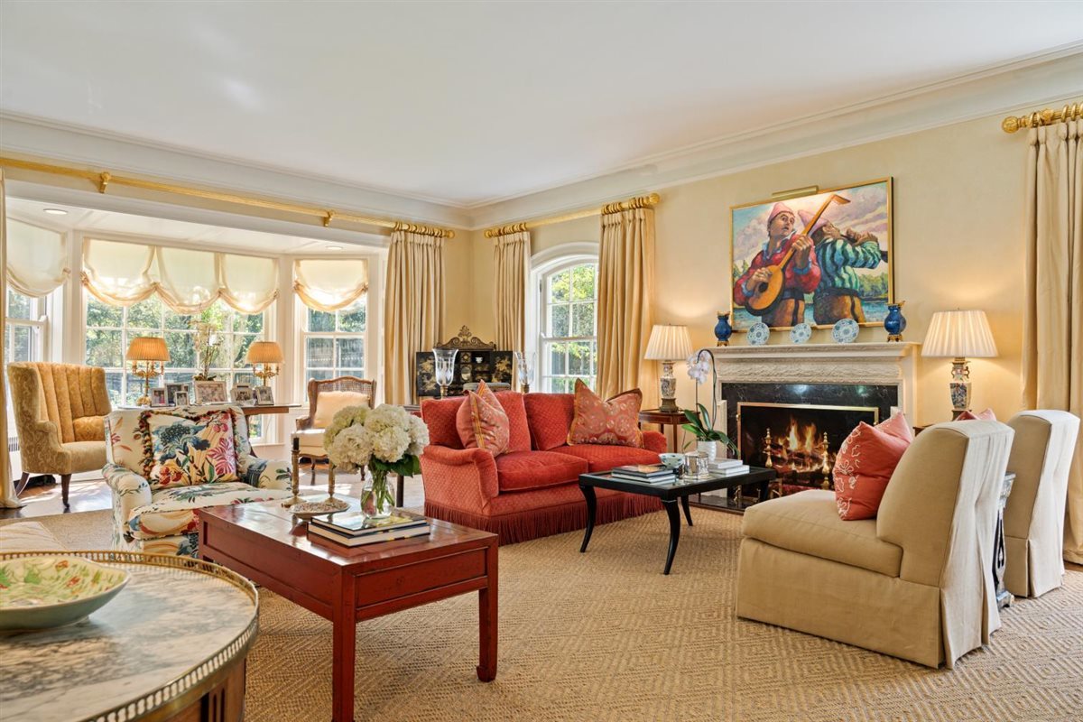 5 Woodley Road Winnetka, IL 60093 - Photo 4 of 48 a living room with furniture a fireplace and a large window