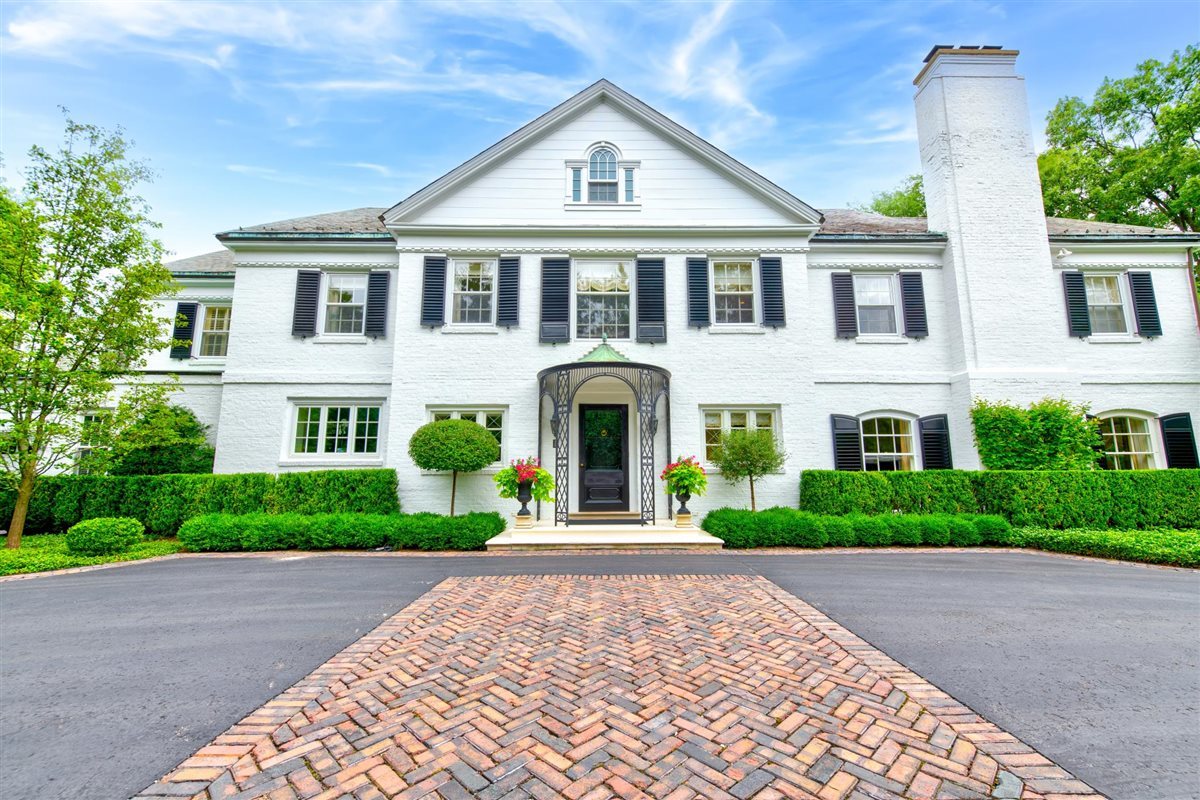 5 Woodley Road Winnetka, IL 60093 - Photo 41 of 48 a front view of a house with a garden