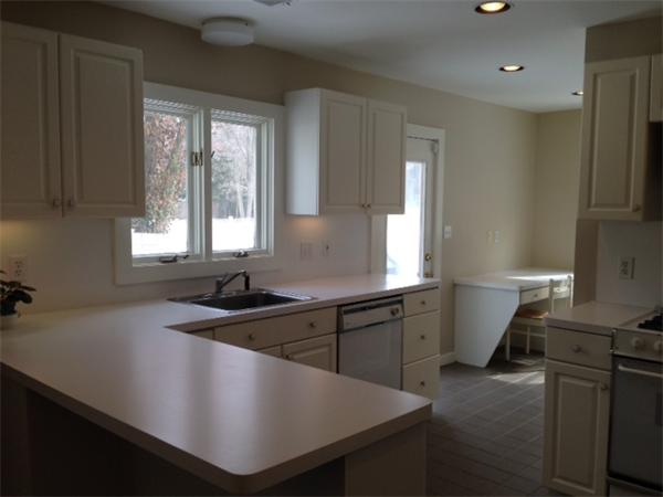 301 Marked Tree Road Needham, MA 02492 - Photo 4 of 19 a kitchen with a sink a stove a refrigerator and cabinets