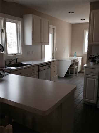 301 Marked Tree Road Needham, MA 02492 - Photo 5 of 19 a kitchen with kitchen island sink and window