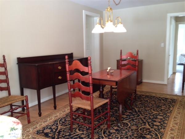 301 Marked Tree Road Needham, MA 02492 - Photo 9 of 19 a dining room with furniture and chandelier