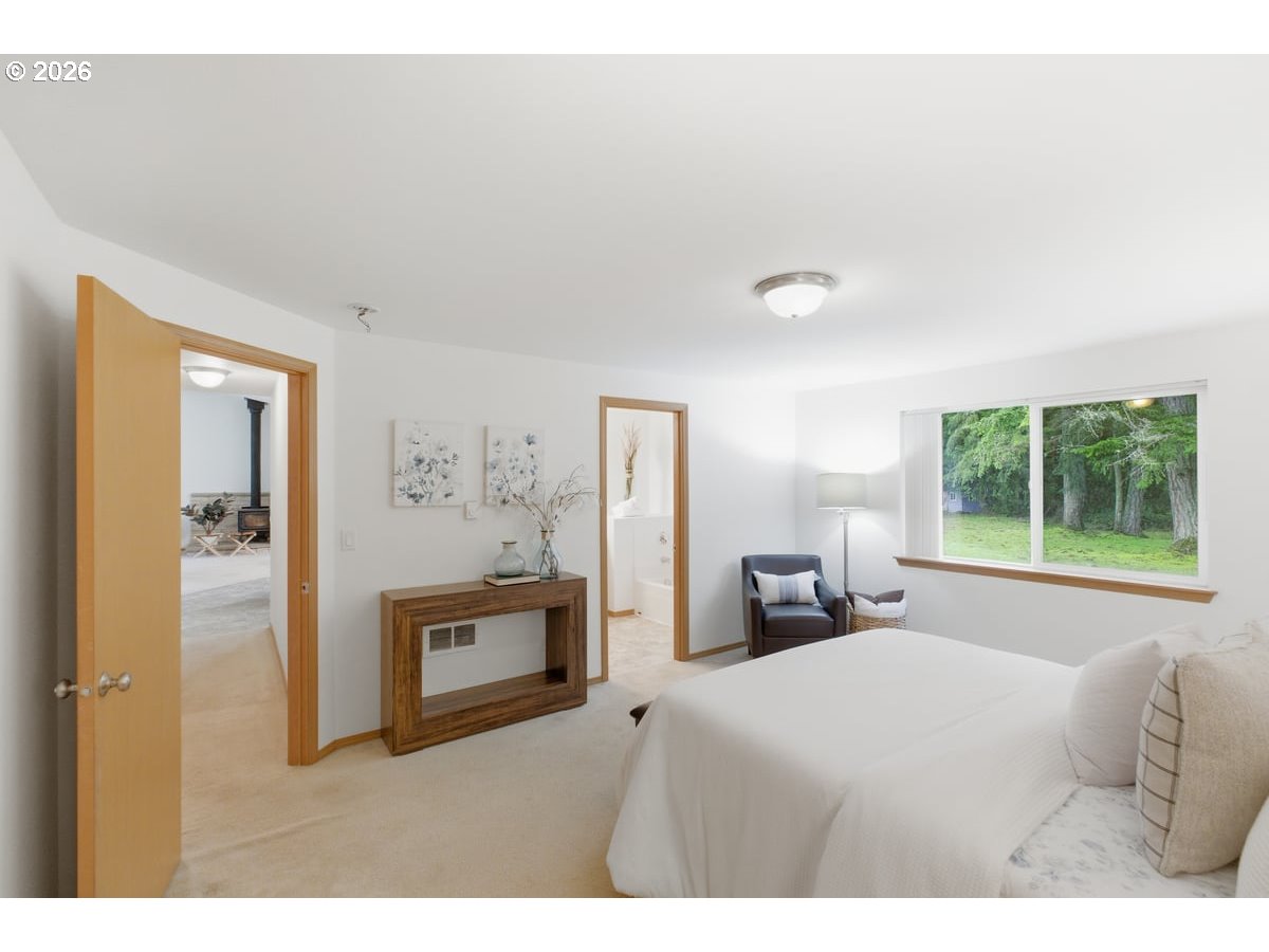 37905 South Wilhoit Road Molalla, OR 97038 - Photo 12 of 48 a bedroom with a bed and a large window