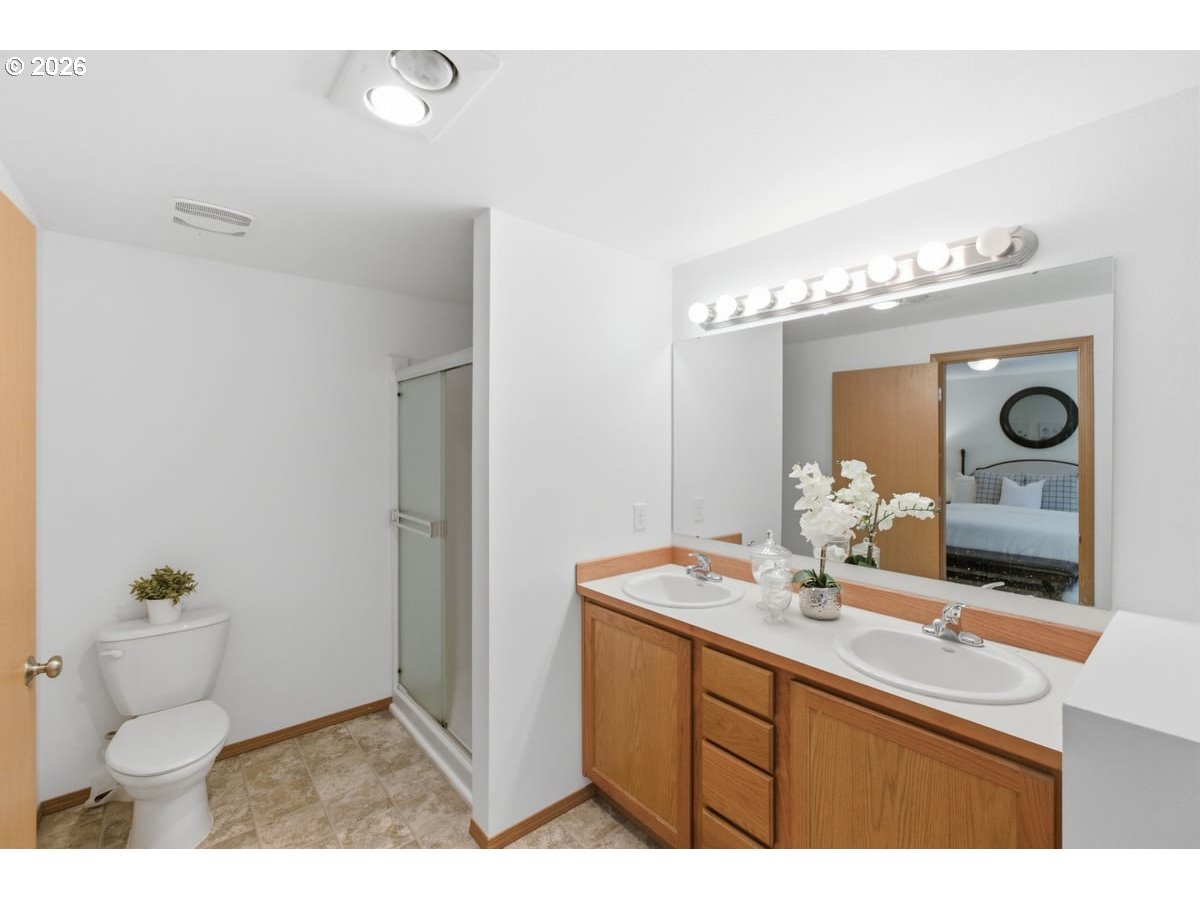 37905 South Wilhoit Road Molalla, OR 97038 - Photo 14 of 48 a bathroom with a toilet sink and mirror