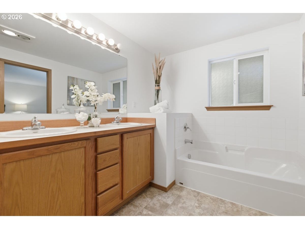 37905 South Wilhoit Road Molalla, OR 97038 - Photo 15 of 48 a bathroom with a tub a sink and mirror