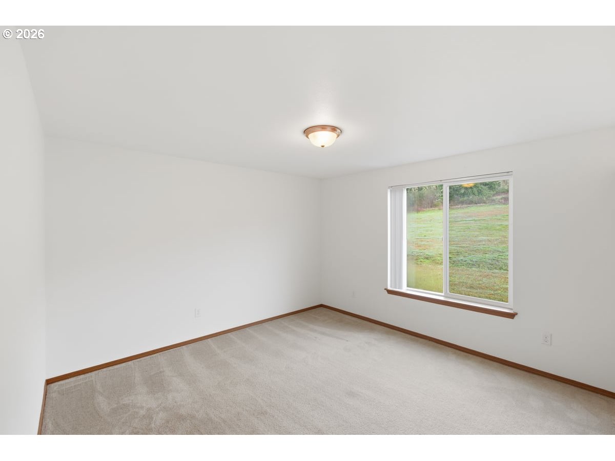 37905 South Wilhoit Road Molalla, OR 97038 - Photo 19 of 48 a view of an empty room with a window