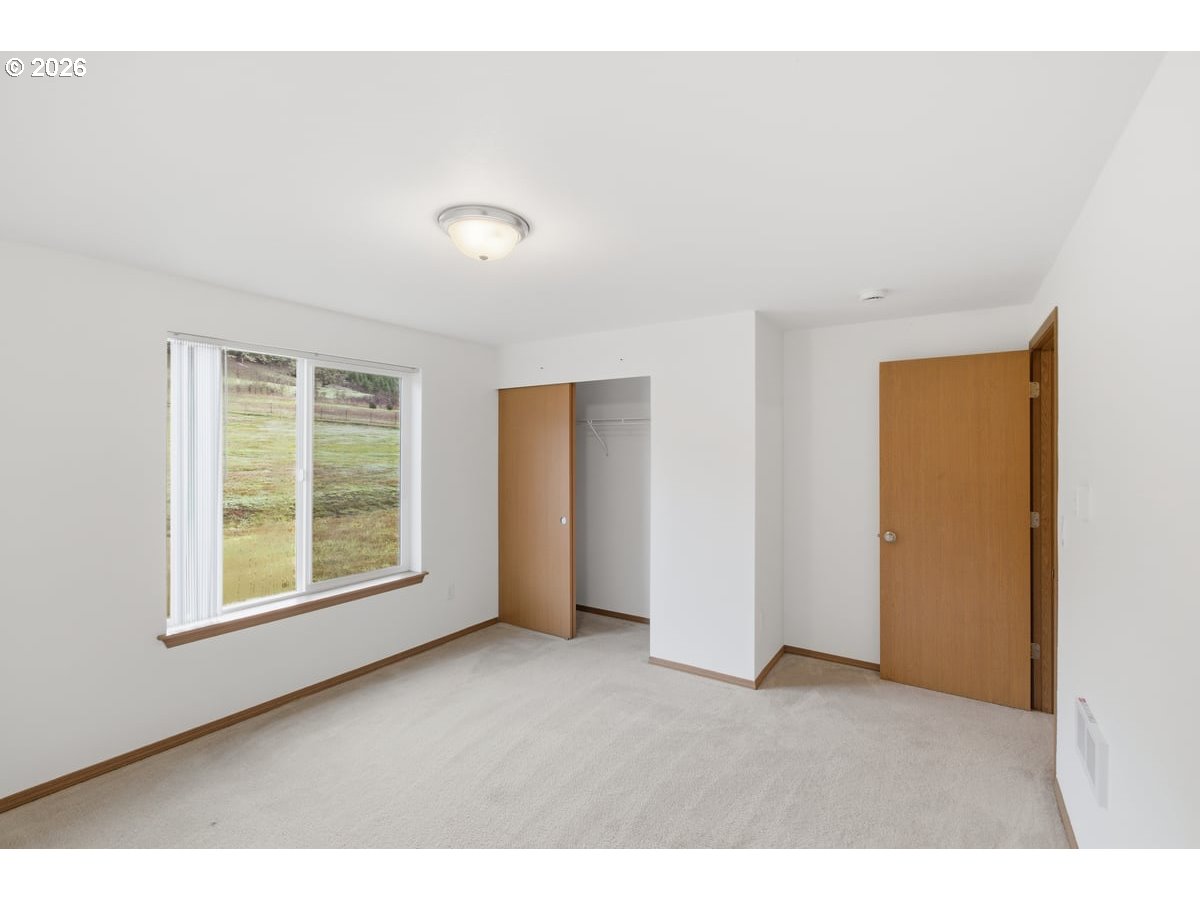 37905 South Wilhoit Road Molalla, OR 97038 - Photo 20 of 48 a view of an empty room with a window