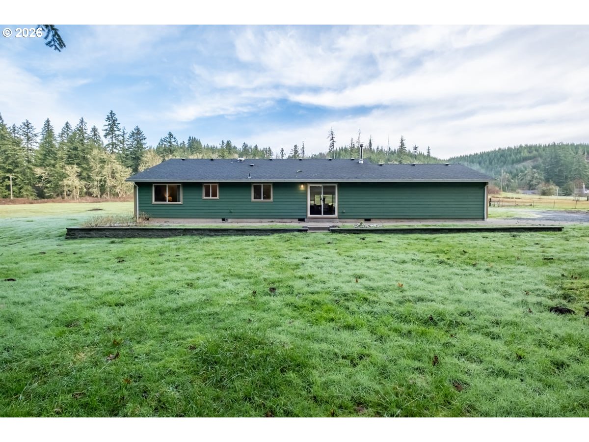 37905 South Wilhoit Road Molalla, OR 97038 - Photo 33 of 48 a view of a house with a big yard and large trees