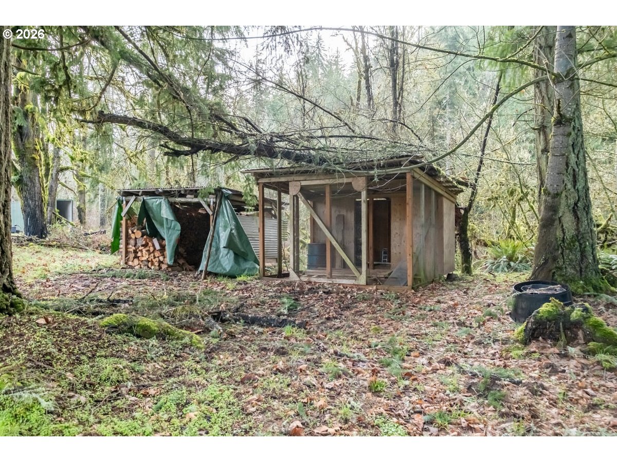 37905 South Wilhoit Road Molalla, OR 97038 - Photo 34 of 48 a view of a wooden house with a yard