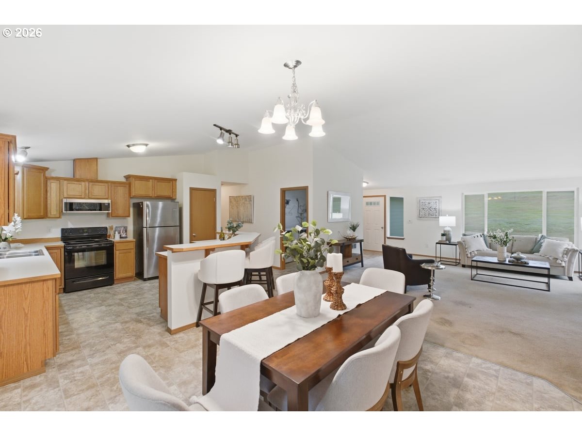 37905 South Wilhoit Road Molalla, OR 97038 - Photo 10 of 48 a living room with fireplace furniture and a chandelier
