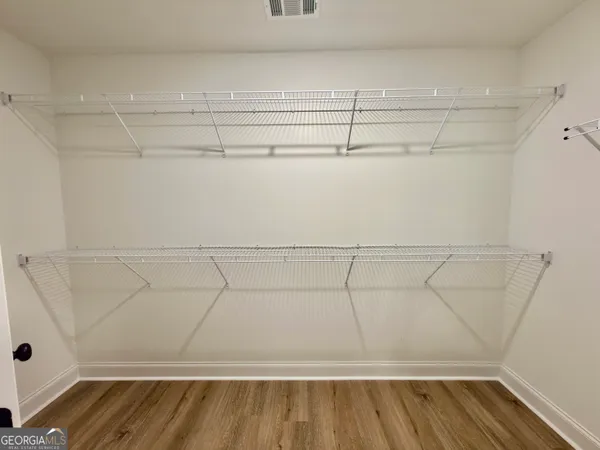 a view of a room with racks on the wall