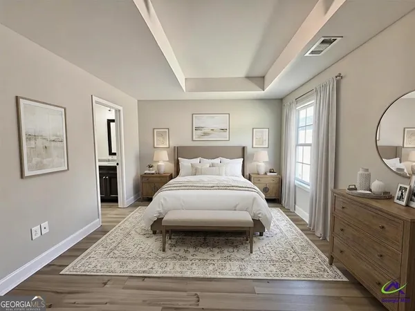 a spacious bedroom with a bed and a dresser