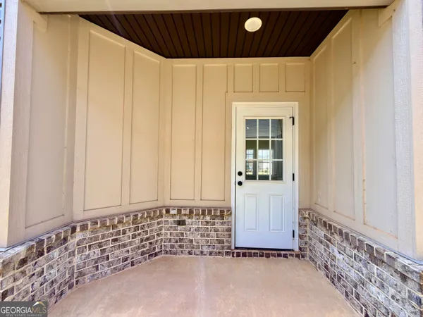 a view of a door and a window