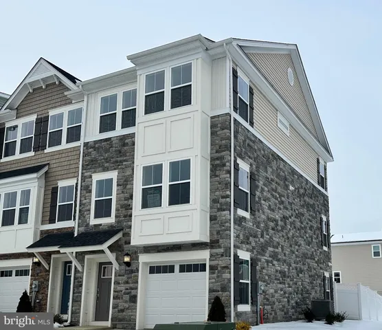 a front view of a building with a lot of windows