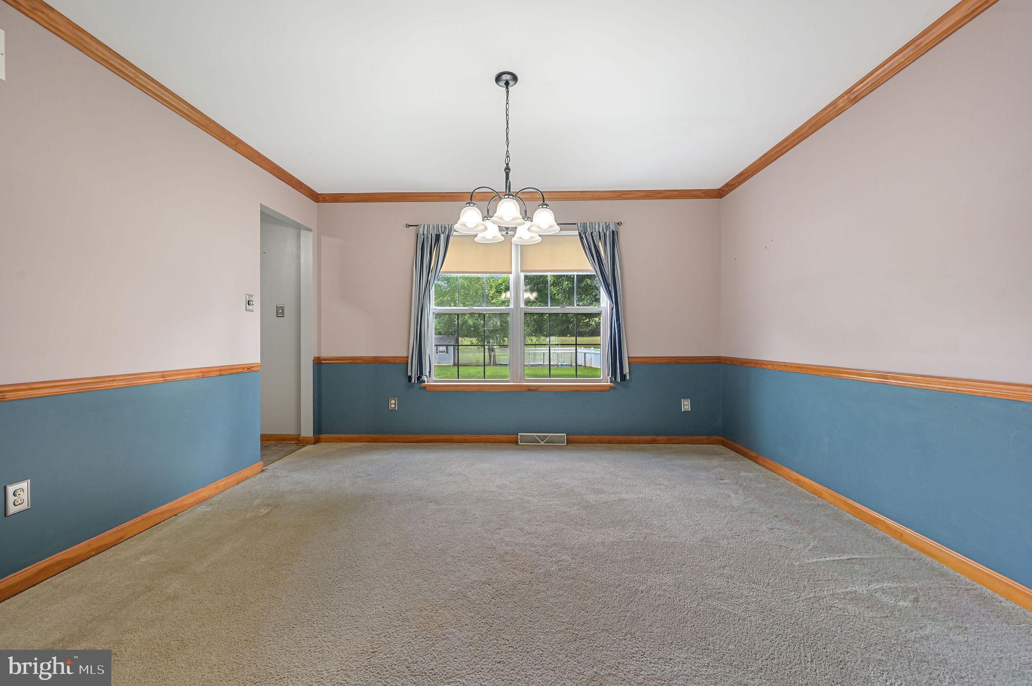 113 Fieldbrook Drive Magnolia, DE 19962 - Photo 16 of 38 an empty room with windows and chandelier fan