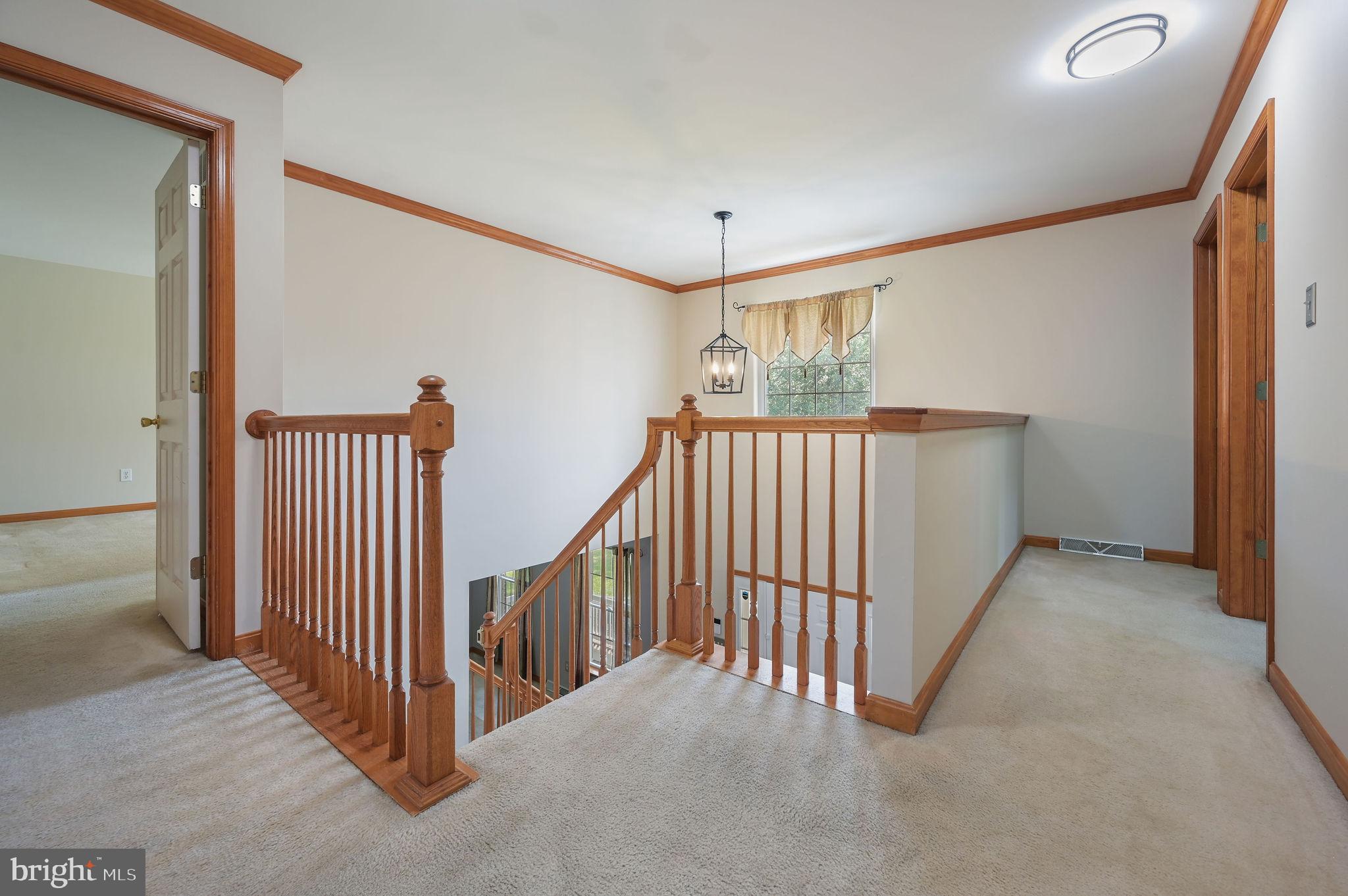 113 Fieldbrook Drive Magnolia, DE 19962 - Photo 21 of 38 a view of a hallway to a room with stairs