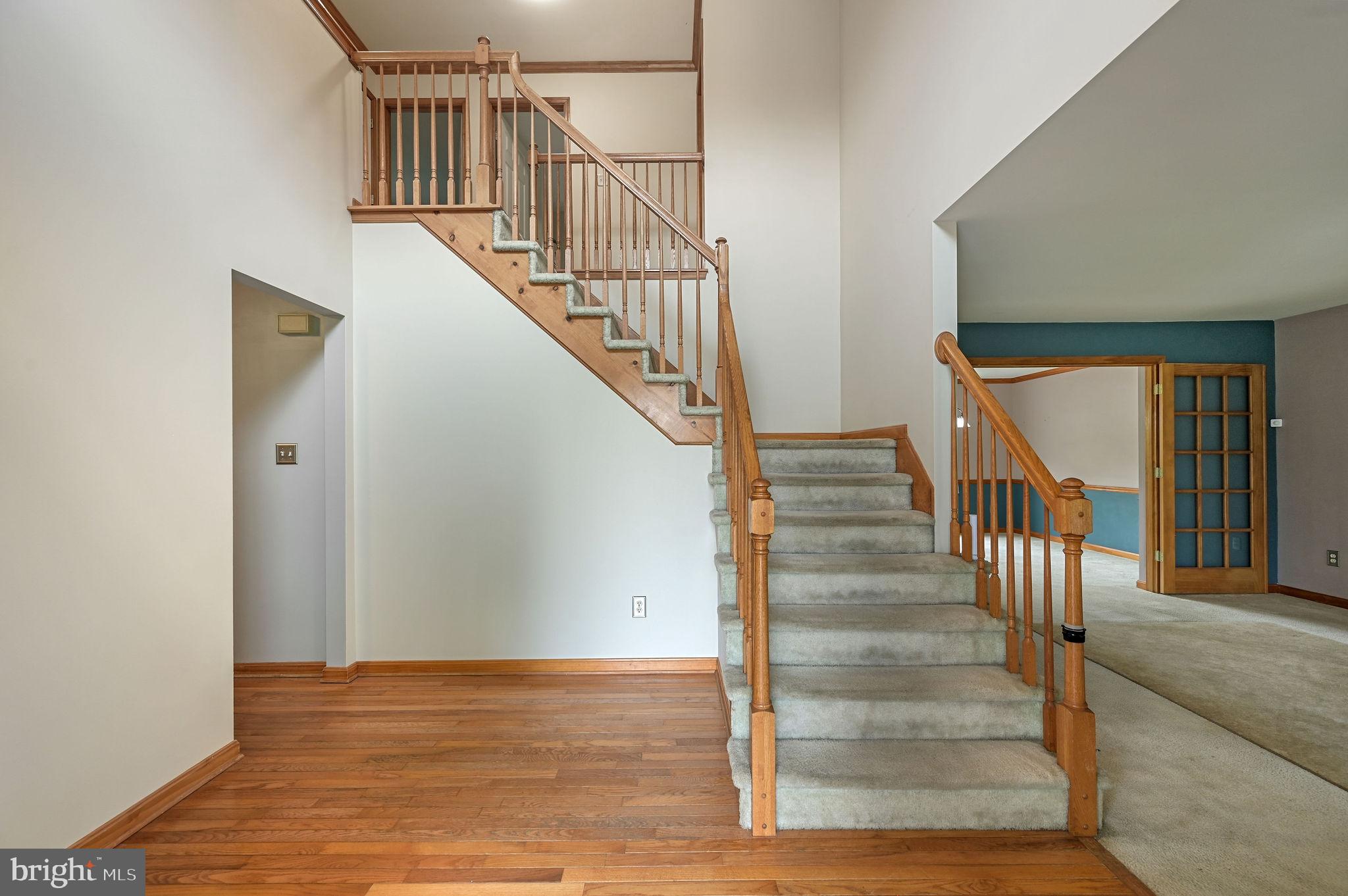 113 Fieldbrook Drive Magnolia, DE 19962 - Photo 5 of 38 a view of staircase with wooden floor and white walls