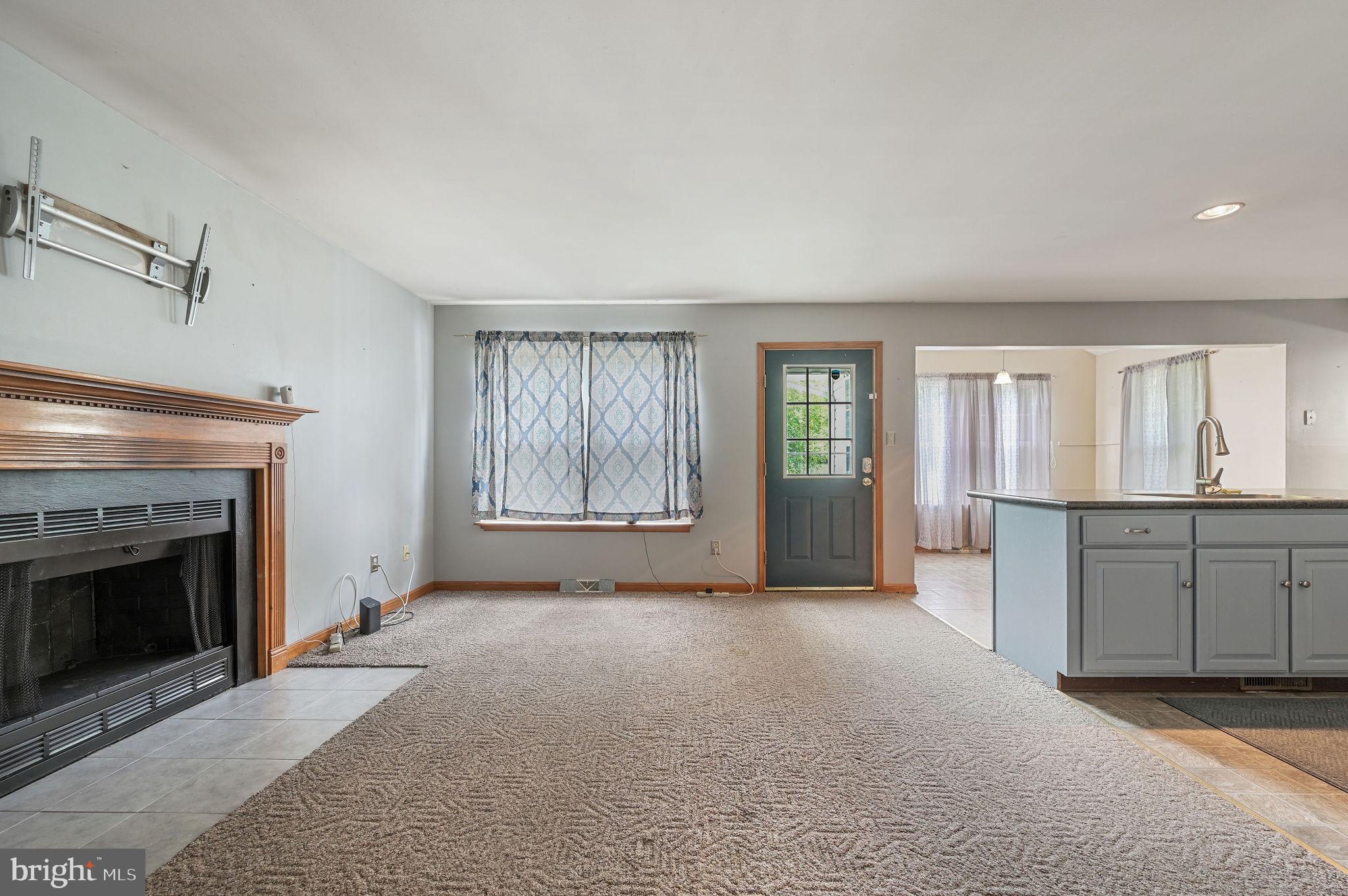113 Fieldbrook Drive Magnolia, DE 19962 - Photo 6 of 38 a view of an empty room with window and fire place