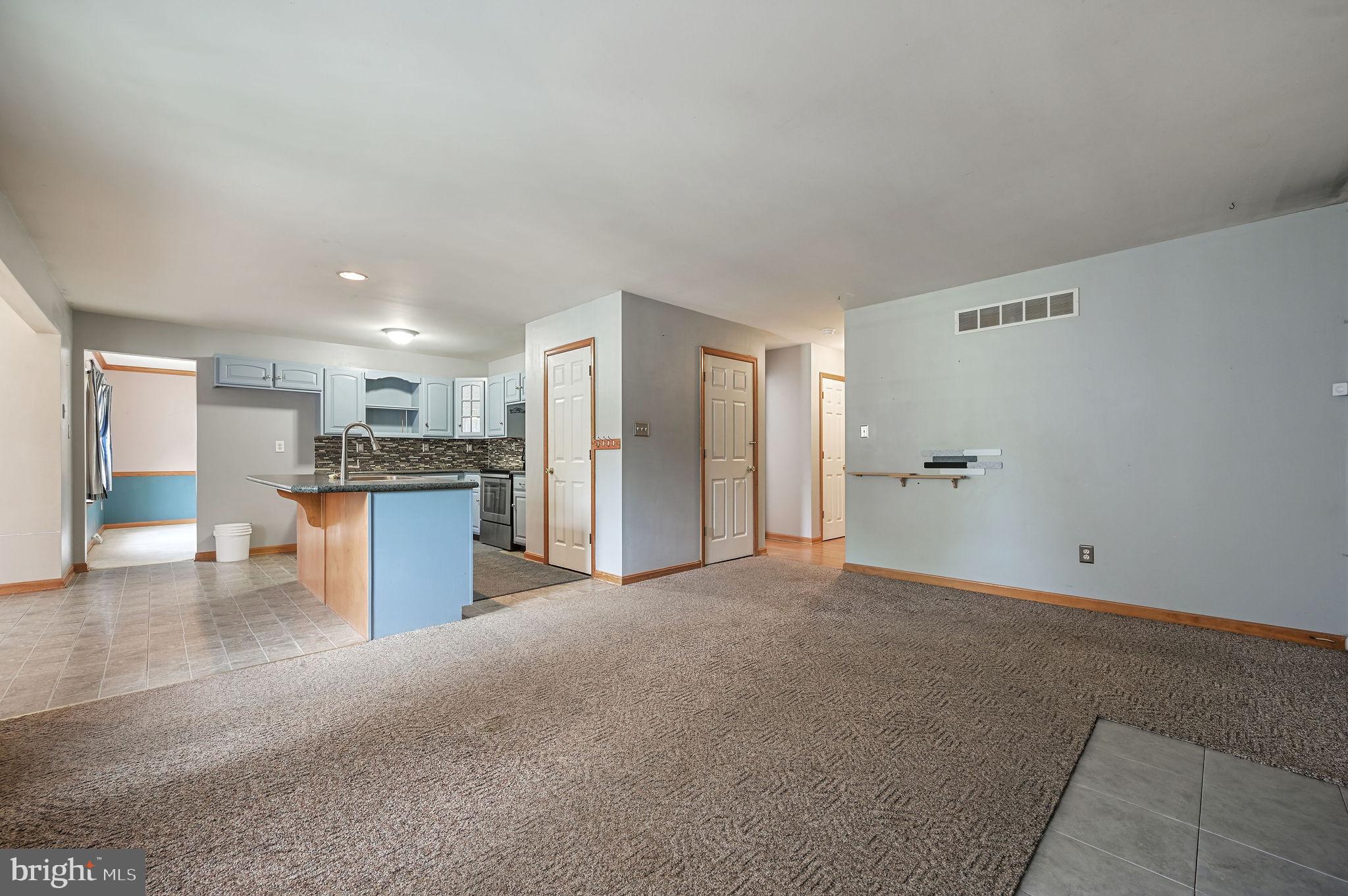 113 Fieldbrook Drive Magnolia, DE 19962 - Photo 7 of 38 a view of a kitchen with a refrigerator and a sink