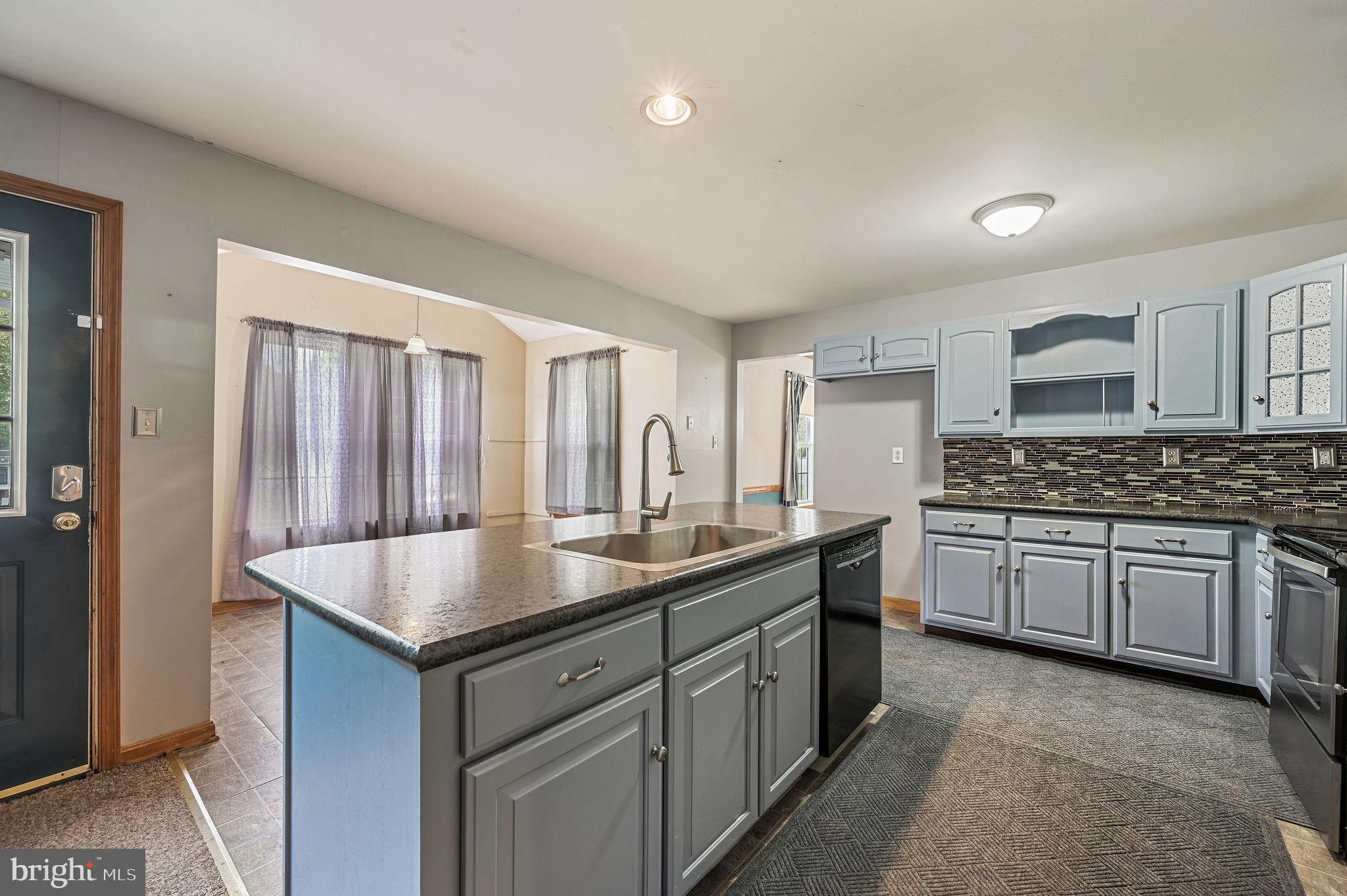 113 Fieldbrook Drive Magnolia, DE 19962 - Photo 9 of 38 a kitchen with a sink stove and cabinets