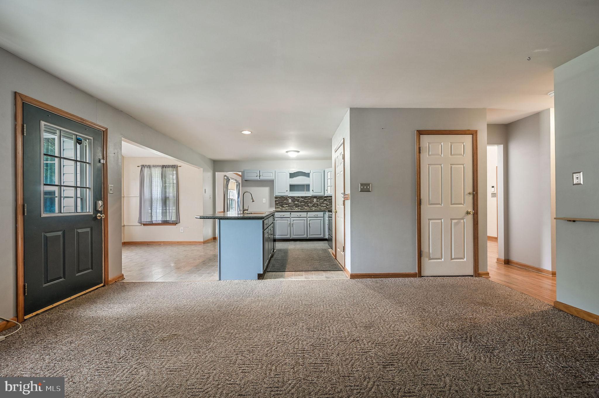 113 Fieldbrook Drive Magnolia, DE 19962 - Photo 10 of 38 a view of a kitchen with refrigerator and wooden floor