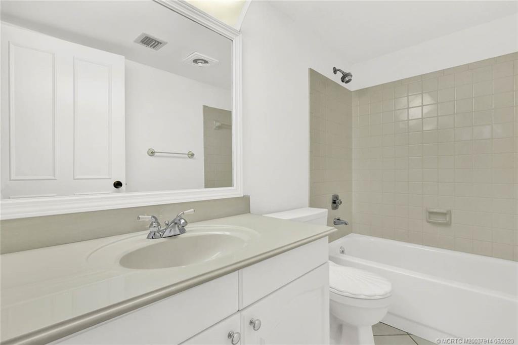 1950 Southwest Palm City Road, Unit 14207 Stuart, FL 34994 - Photo 29 of 50 a bathroom with a sink toilet a bathtub and a vanity