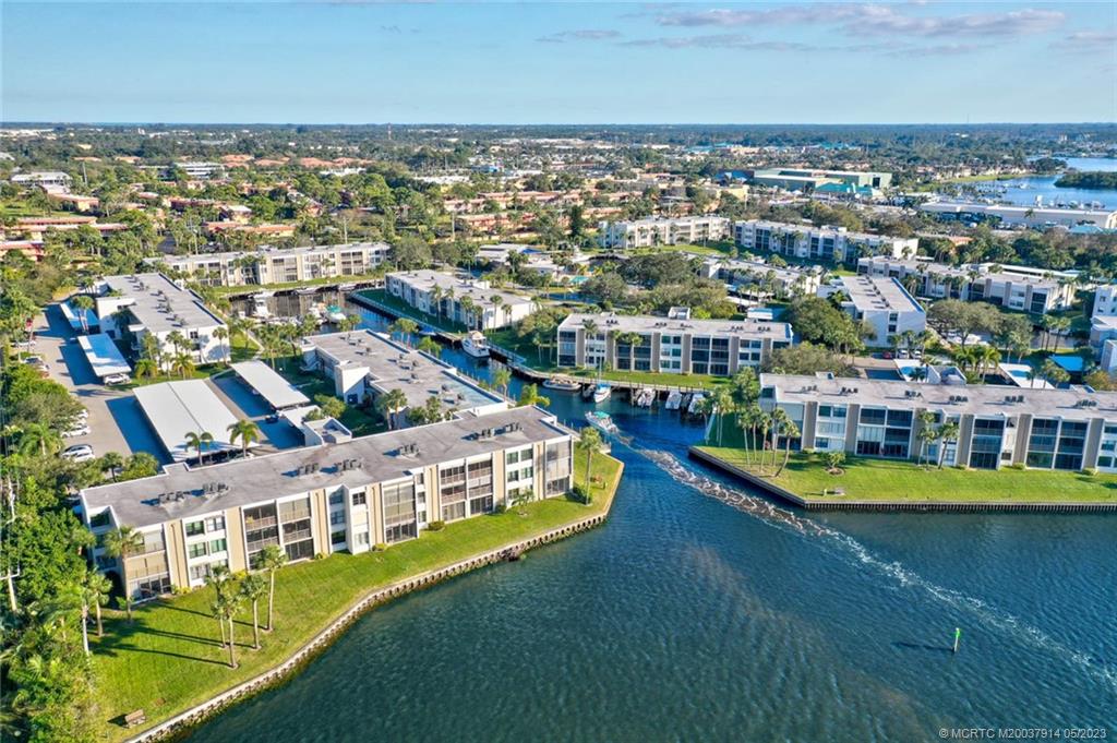 1950 Southwest Palm City Road, Unit 14207 Stuart, FL 34994 - Photo 32 of 50 an aerial view of residential houses with outdoor space