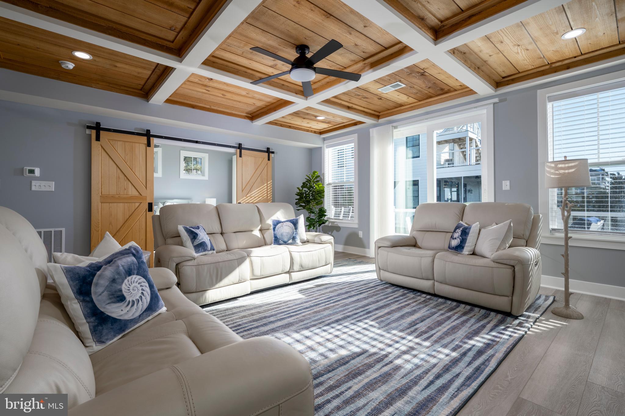 39546 Admiral Road Bethany Beach, DE 19930 - Photo 13 of 73 a living room with furniture and a large window