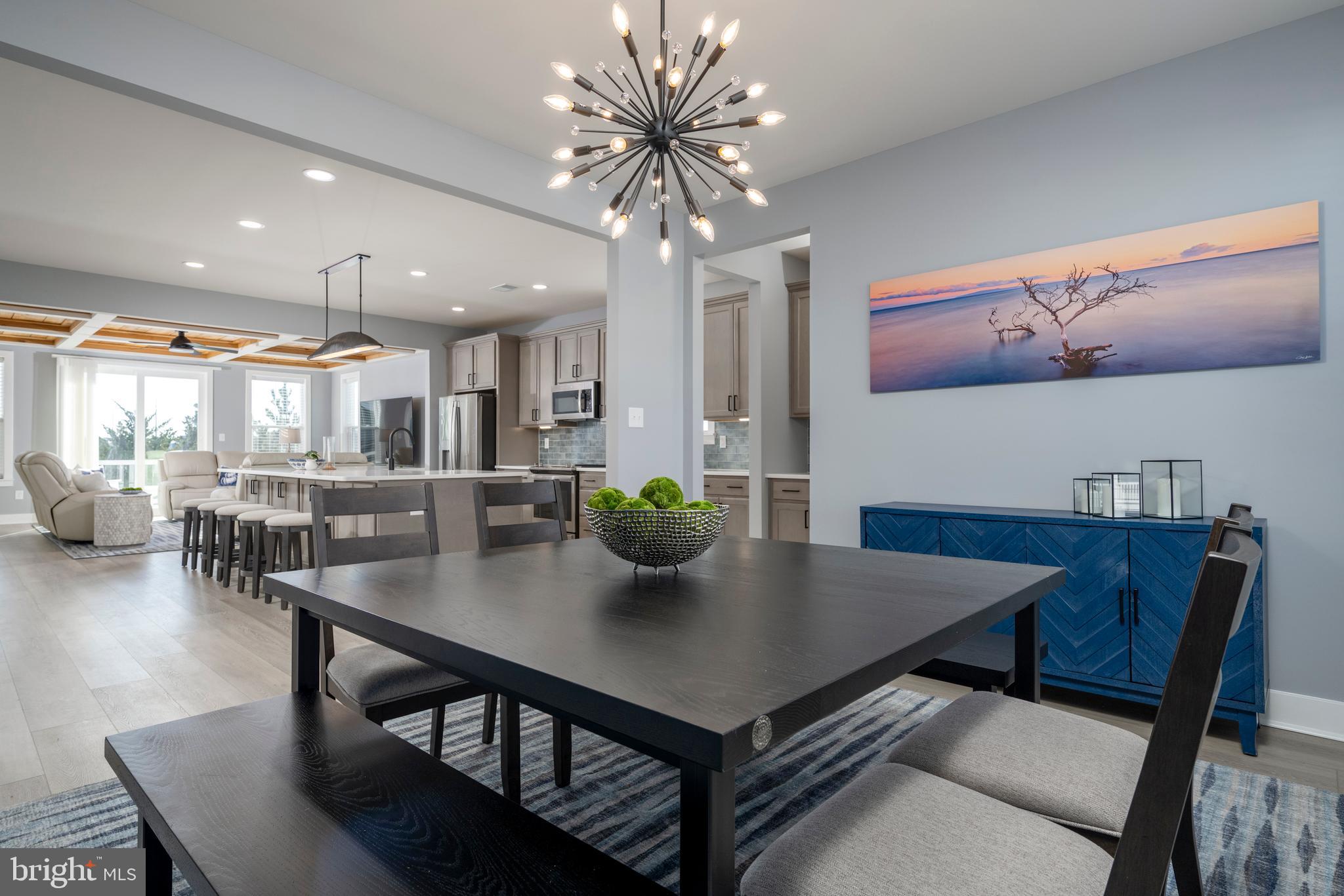 39546 Admiral Road Bethany Beach, DE 19930 - Photo 19 of 73 a view of a dining room with furniture and wooden floor