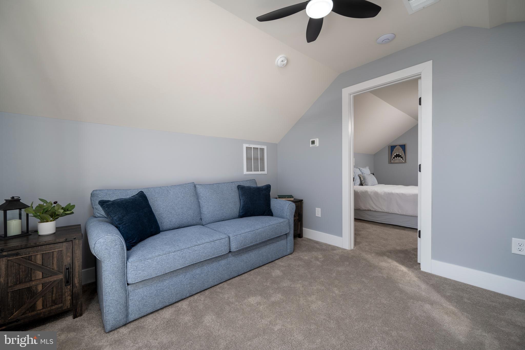 39546 Admiral Road Bethany Beach, DE 19930 - Photo 33 of 73 a living room with furniture and a ceiling fan