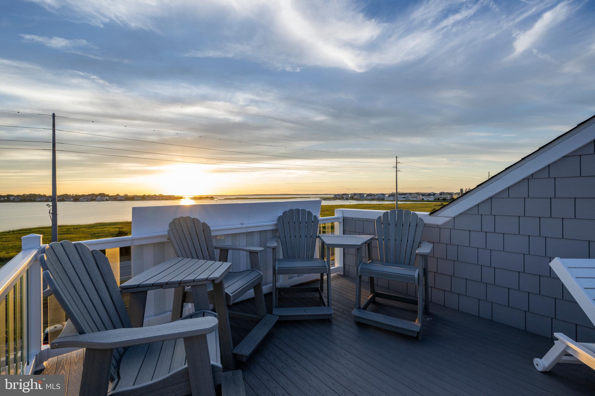 39546 Admiral Road Bethany Beach, DE 19930 - Photo 71 of 73 a view of a balcony with furniture and wooden floor