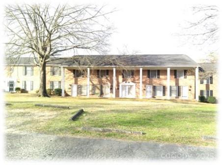 153 West End Street Chester, SC 29706 - Photo 2 of 27 a front view of a house with a yard and trees