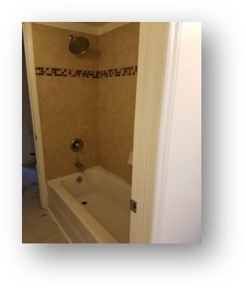 153 West End Street Chester, SC 29706 - Photo 22 of 27 a bathroom with a tub and a shower