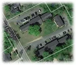 an aerial view of house with a yard