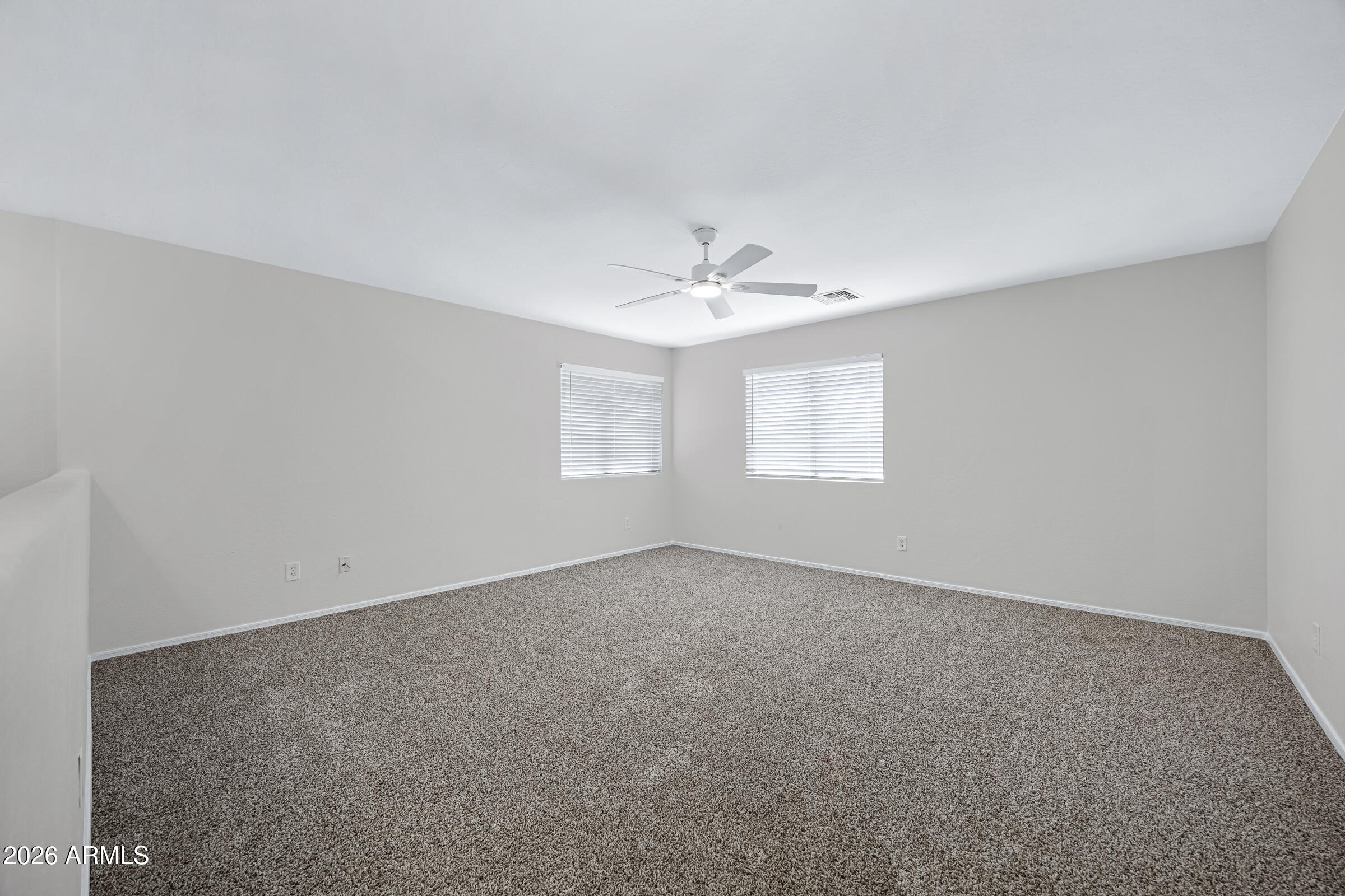 19408 North Braden Road Maricopa, AZ 85138 - Photo 28 of 51 a view of an empty room with a window
