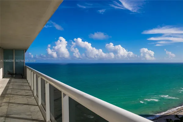 a view of a balcony with an outdoor space