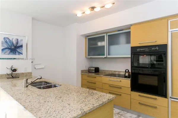 a kitchen with a stove and a microwave
