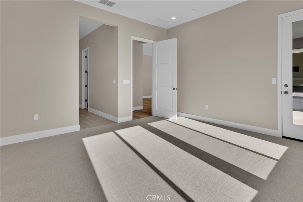 1324 Cava Road Paso Robles, CA 93446 - Photo 8 of 15 a spacious bedroom with a bed and a window