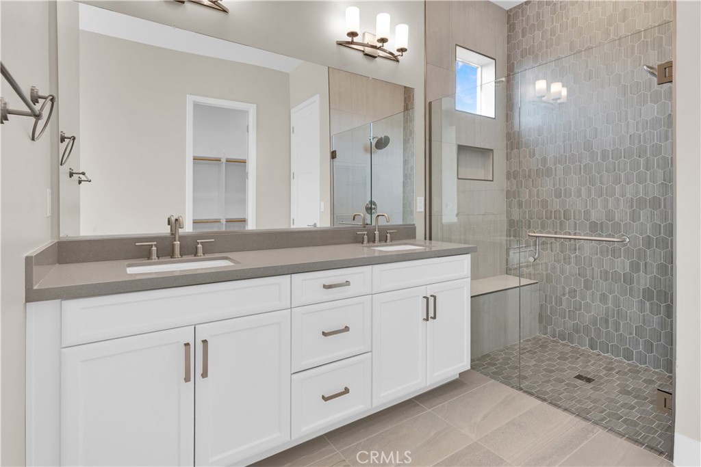 1324 Cava Road Paso Robles, CA 93446 - Photo 10 of 15 a bathroom with a granite countertop sink a mirror and a shower
