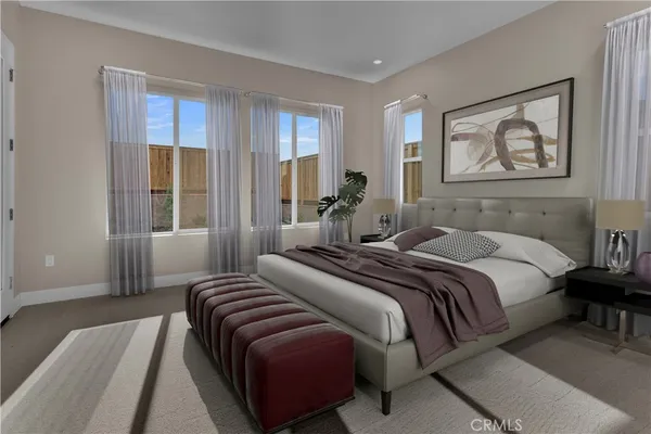 a bedroom with a bed lamp and window
