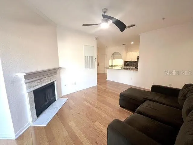 a living room with furniture and a fireplace