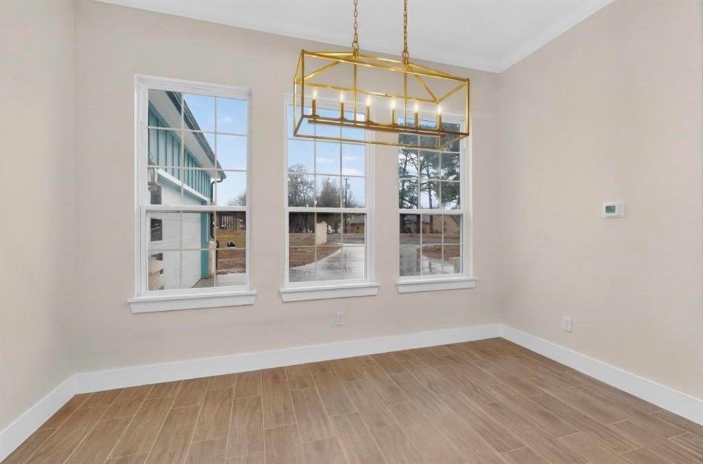 335 Cross Tie Ranch Road Trinidad, TX 75163 - Photo 13 of 30 Rectangular chandelier with a gold-tone finish and five exposed bulbs
