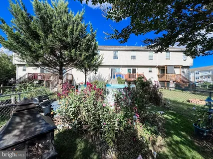 a view of a house with a flower garden