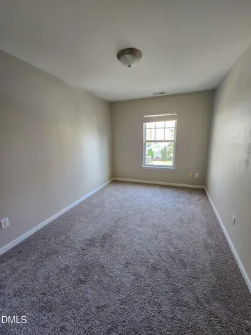 an empty room with windows and windows