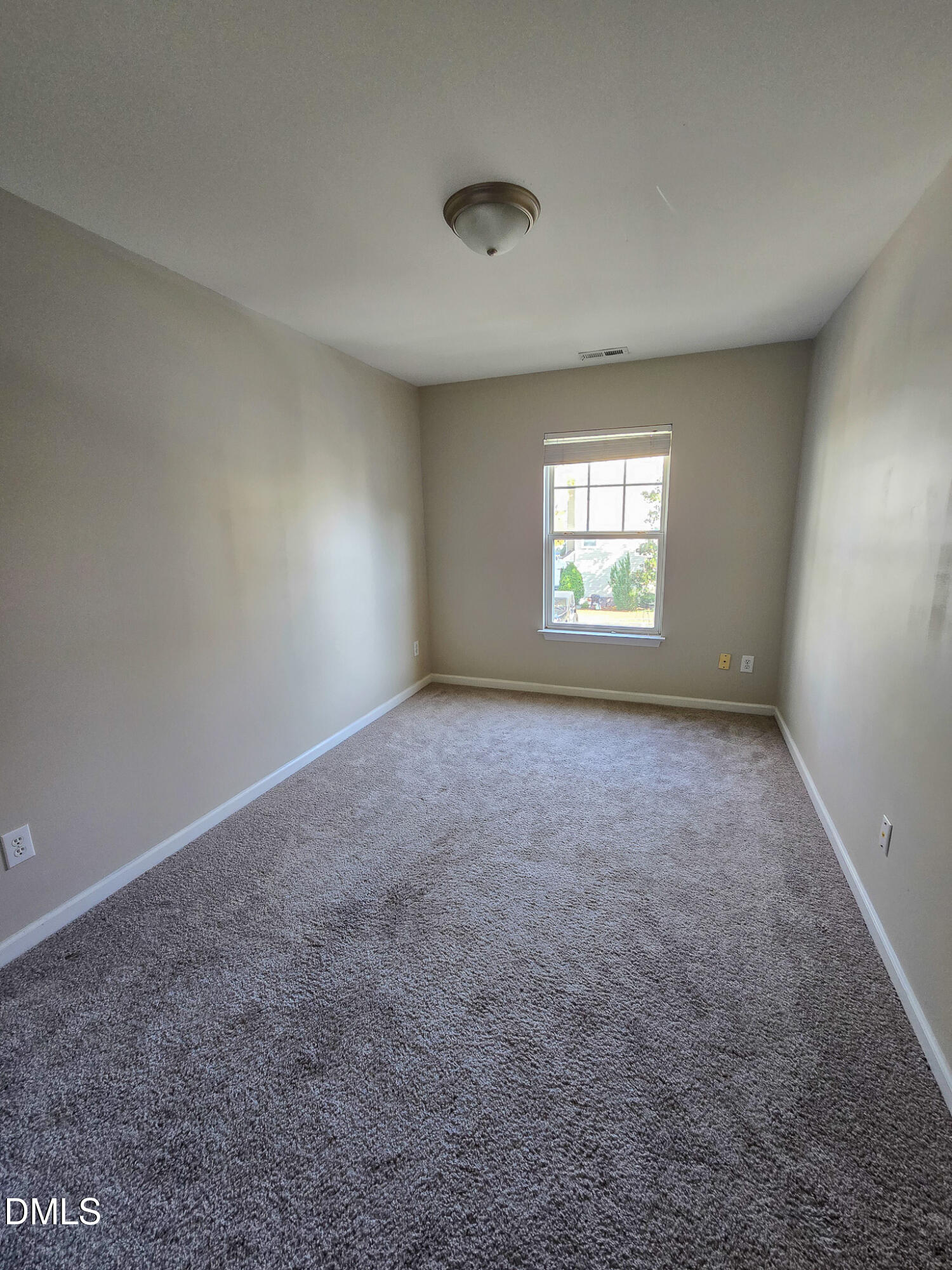 8641 Neuse Club Lane Raleigh, NC 27616 - Photo 16 of 35 an empty room with windows and windows