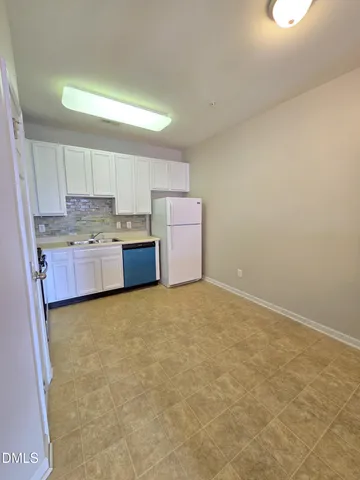 a room with a cabinets and window