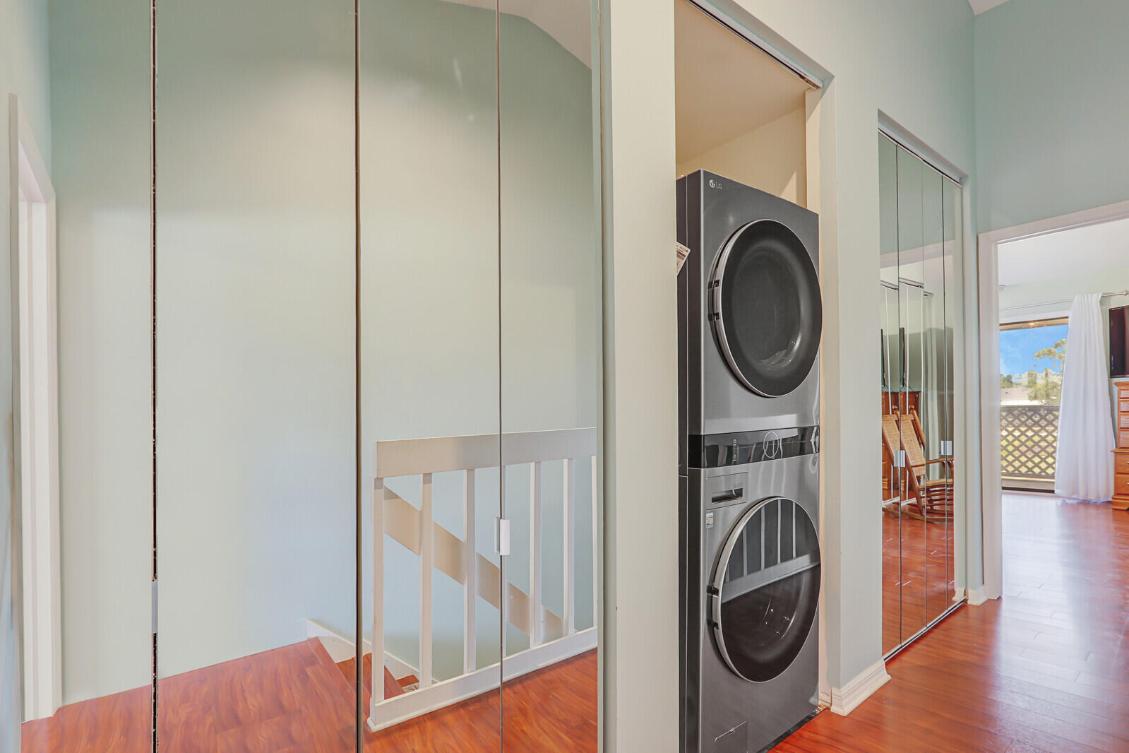 6148 Southeast Georgetown Place, Unit 805 Hobe Sound, FL 33455 - Photo 34 of 44 a view of a hallway with washer and dryer
